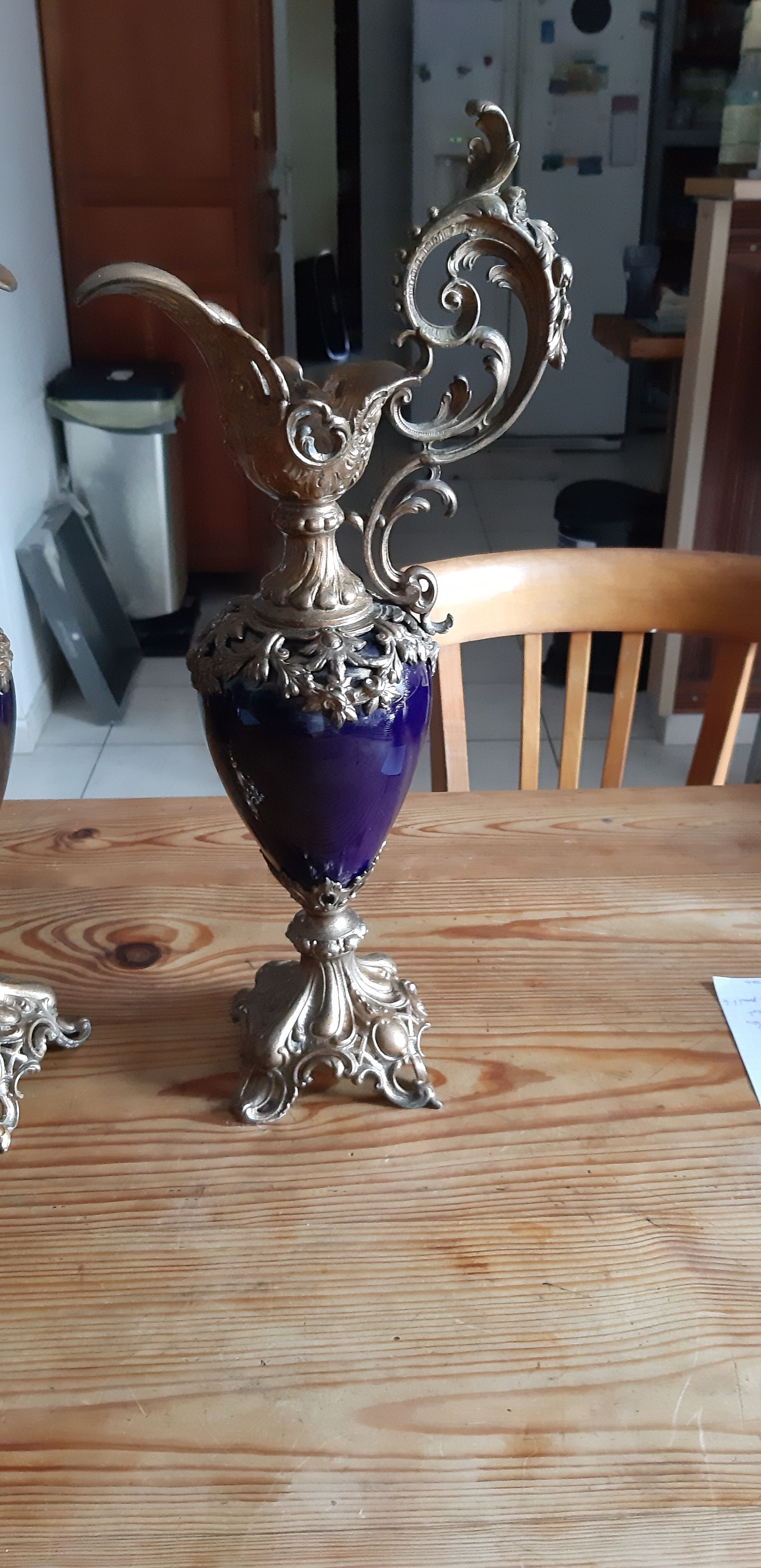 Pair of golden regulated ewers and blue glass