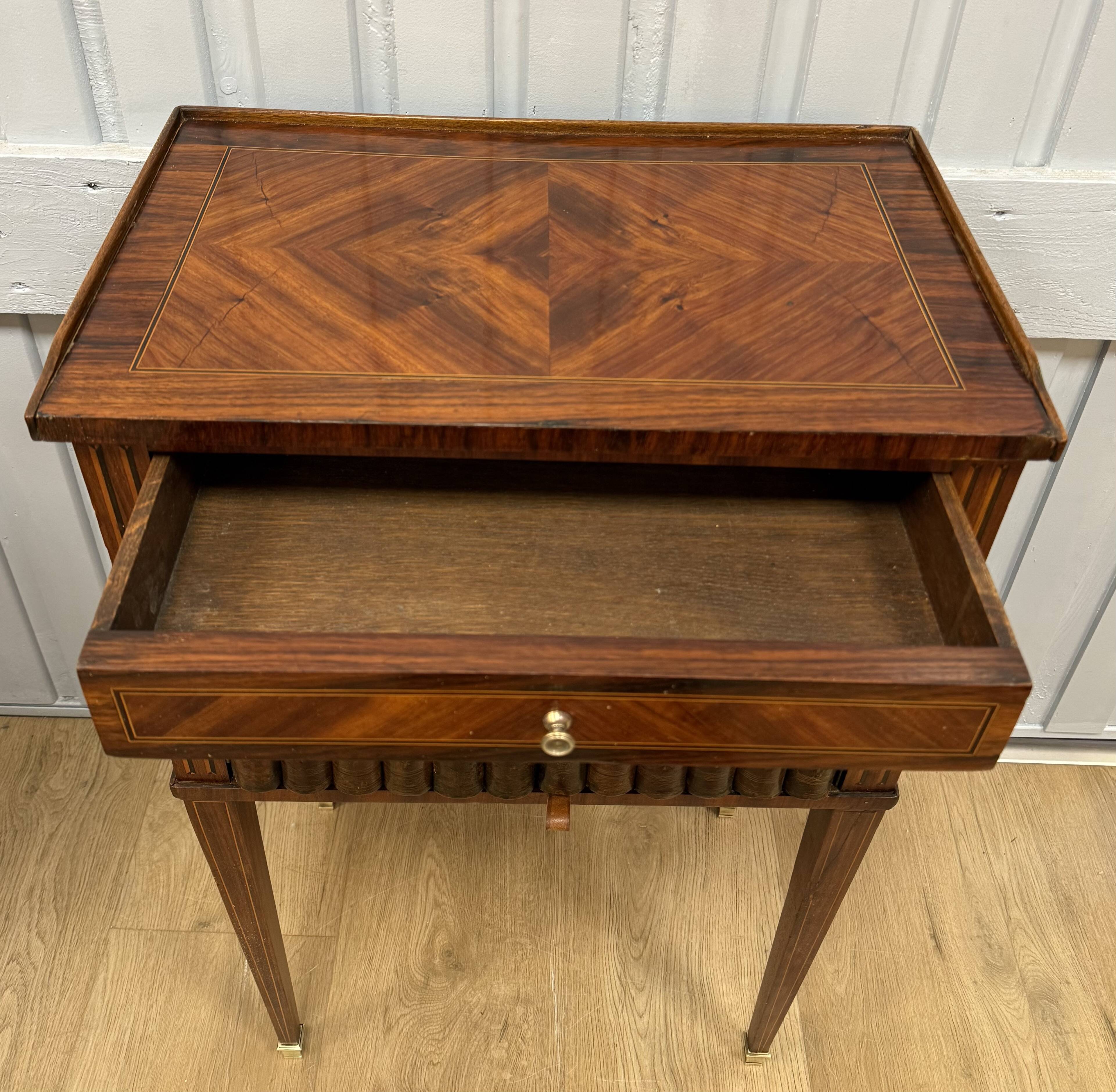 Side table with a faux book front.