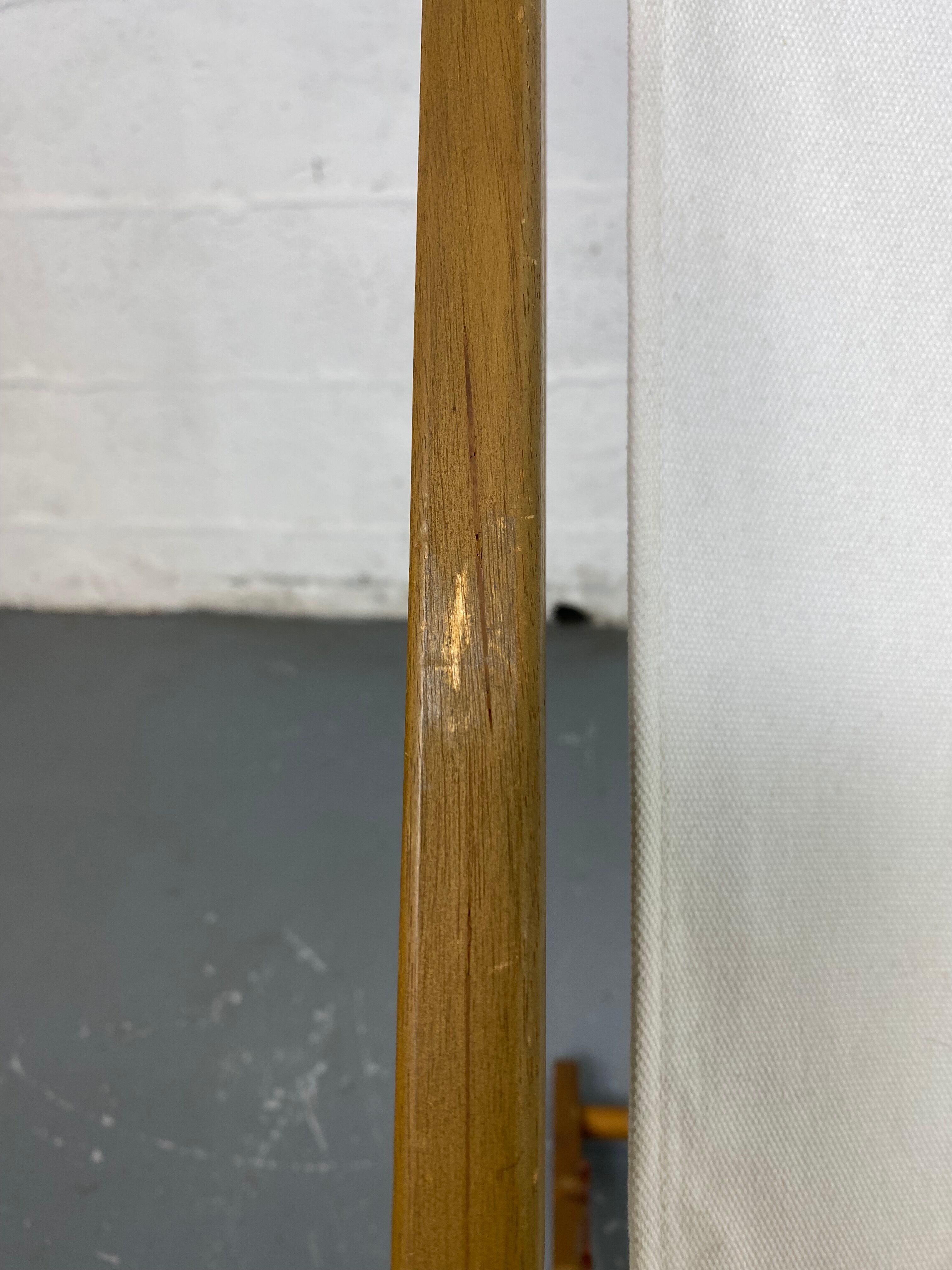 White fabric deckchair with wooden structure