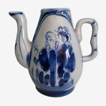 Small old Asian pitcher made of porcelain