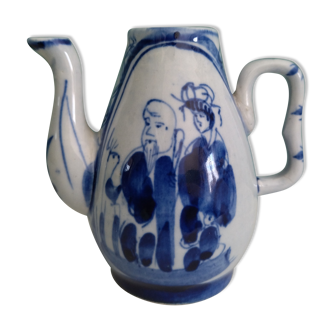 Small old Asian pitcher made of porcelain