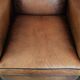 Large and comfortable sheepskin leather wingback chair with black piping