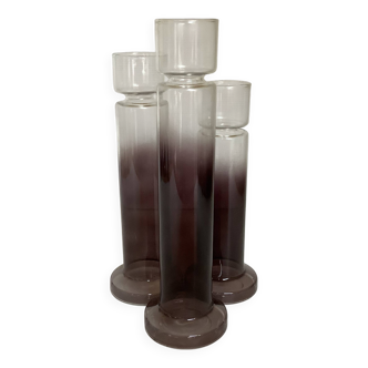 Trio of purple glass vases or candle holders