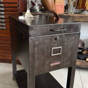 Vintage industrial filing cabinet on wheels