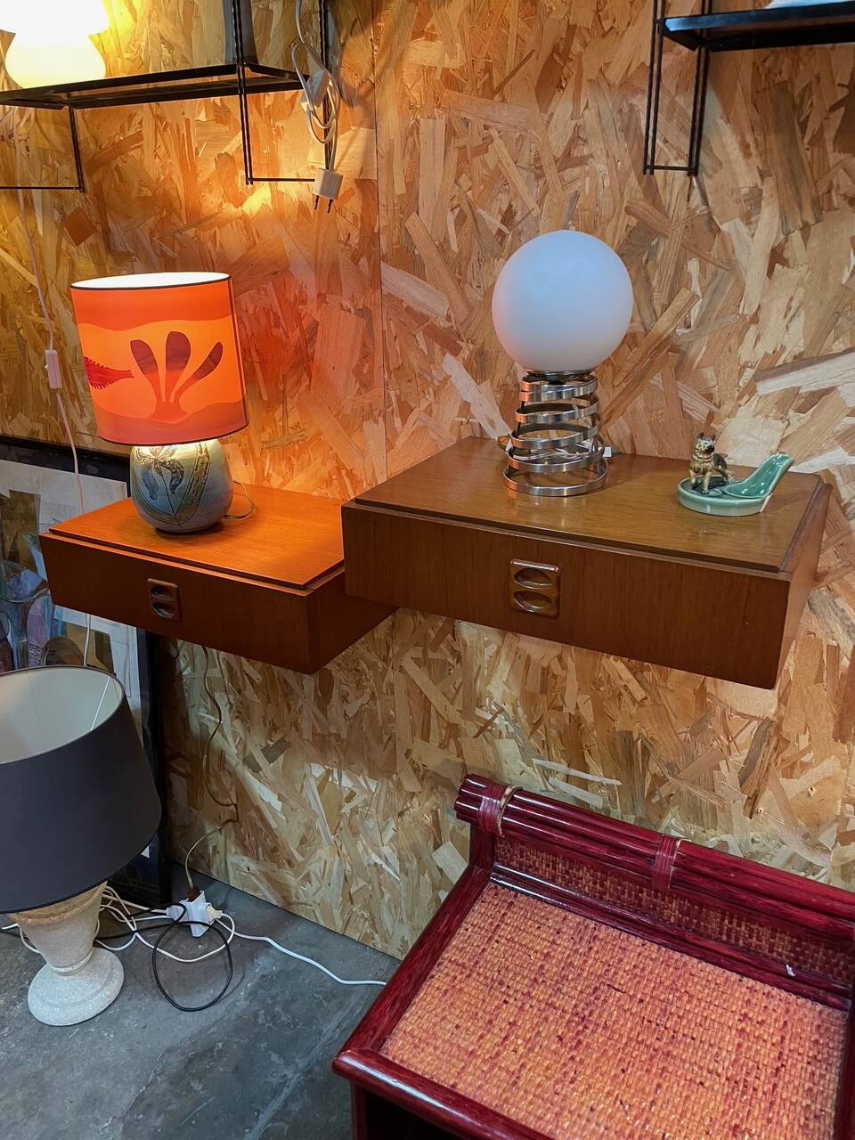 Suspended teak bedside tables in vintage 1960s Scandinavian style.