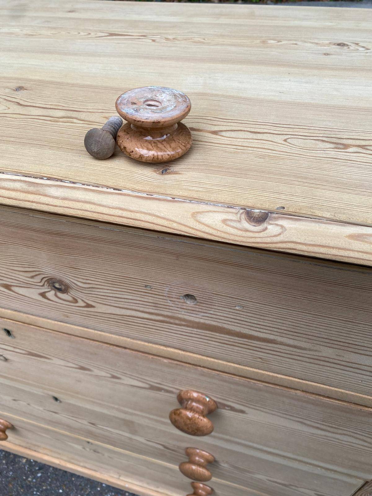 Victorian commode from the 19th century stripped to raw solid wood with ceramic knobs.