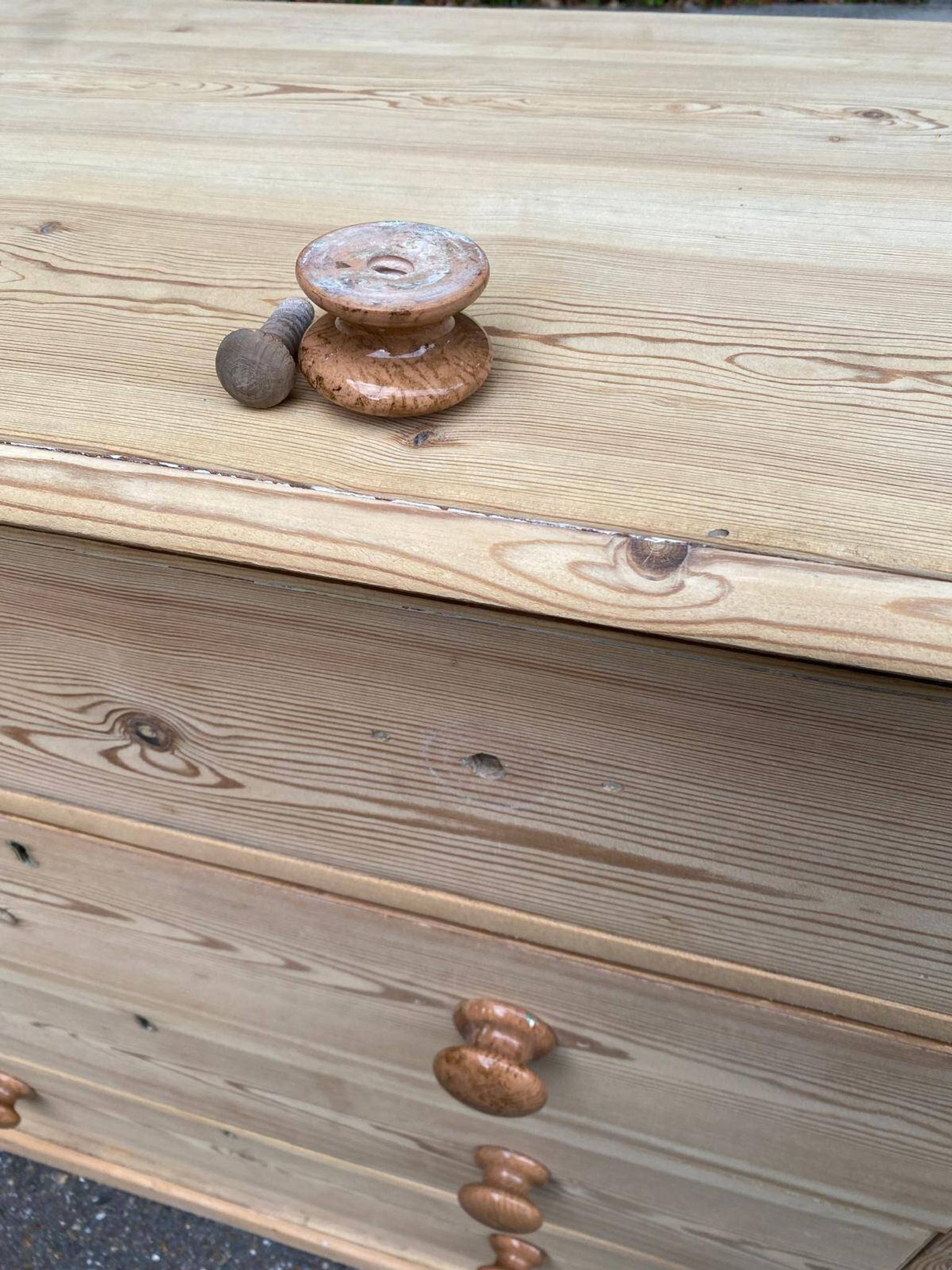 Victorian commode from the 19th century stripped to raw solid wood with ceramic knobs.