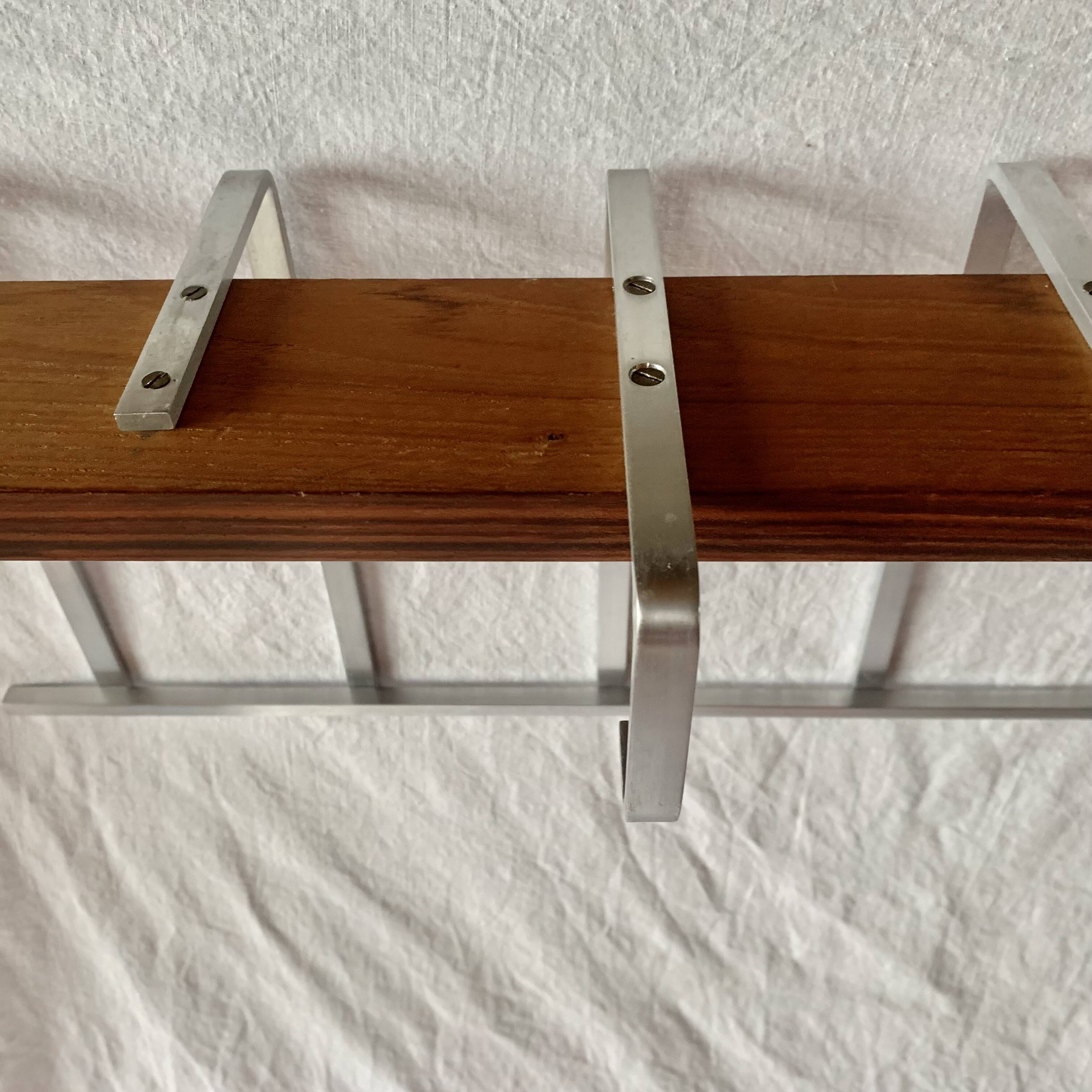 Vintage wall-mounted coat rack made of plywood and aluminum with hat rack