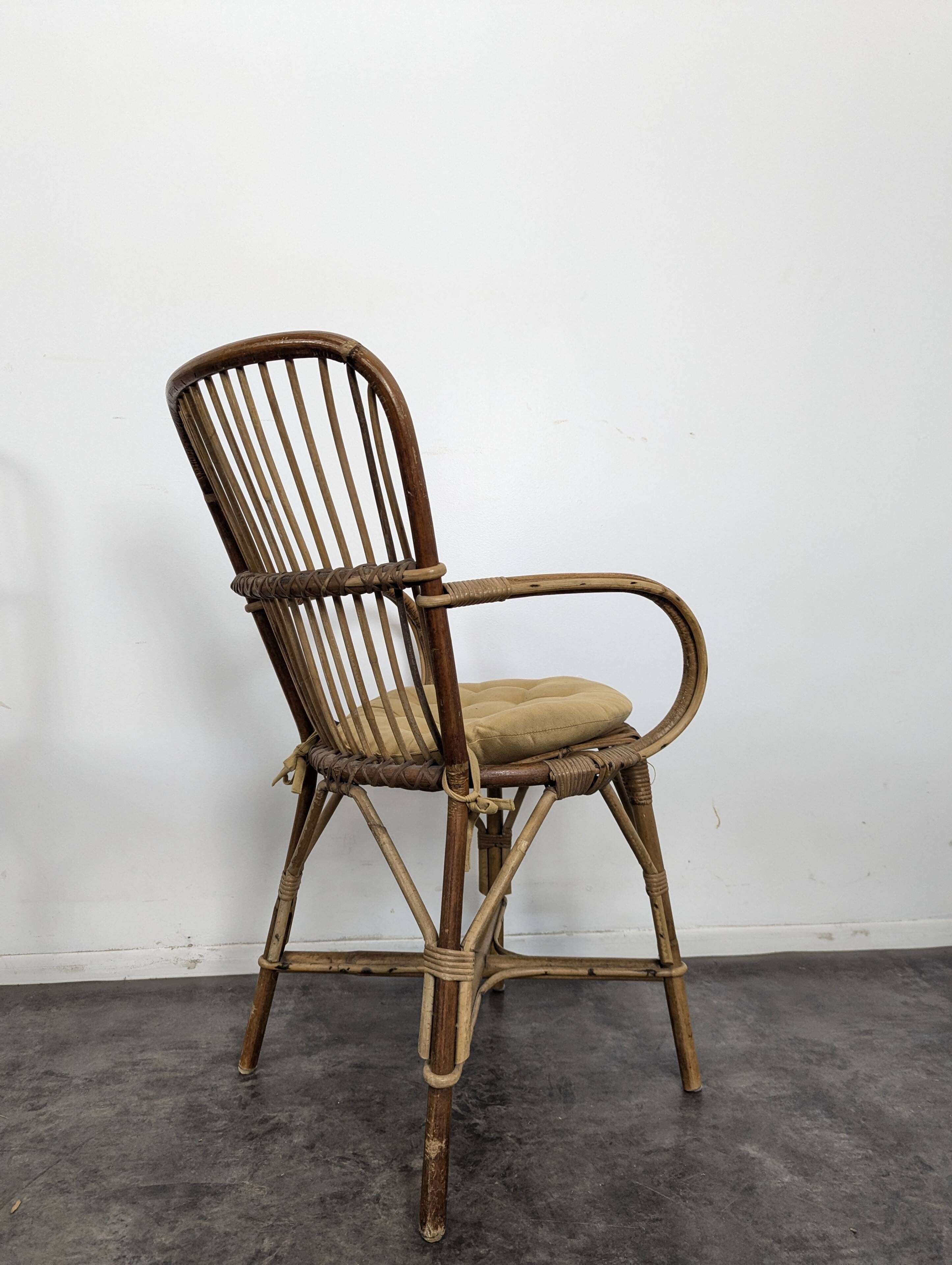 Set of 3 chairs and a rattan armchair.