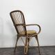 Set of 3 chairs and a rattan armchair.