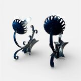 Vintage wrought iron wall lights in rustic gothic style.