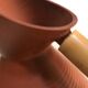 Studio pottery jug floor vase in terracotta and bamboo handle Germany 1950s