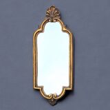 Old small wall mirror in golden resin