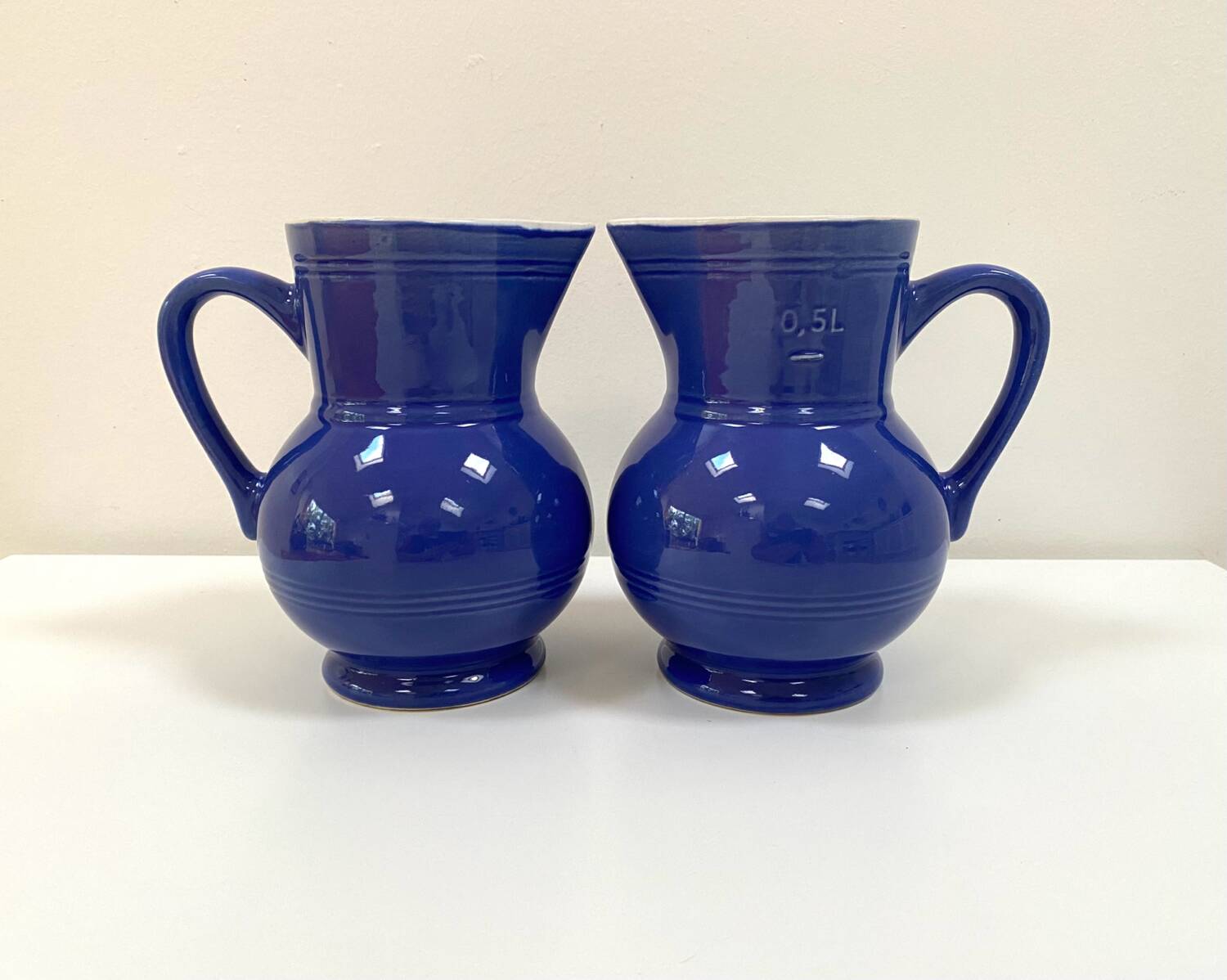 Duo of Emile Henry bistro pitchers