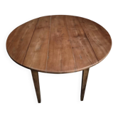 Rustic French antique dining table, drop-leaf table in cherry wood, circa 1900.