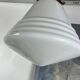 Pair of opaline glass pendant lights in white by Philips and brass from the 1920s.