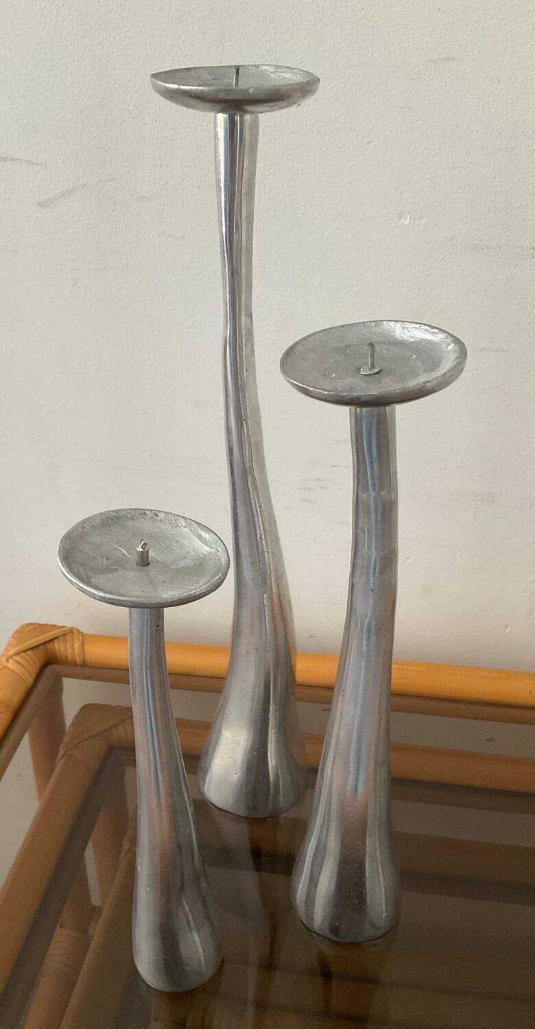 Trio of vintage cast aluminum candlesticks