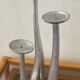 Trio of vintage cast aluminum candlesticks