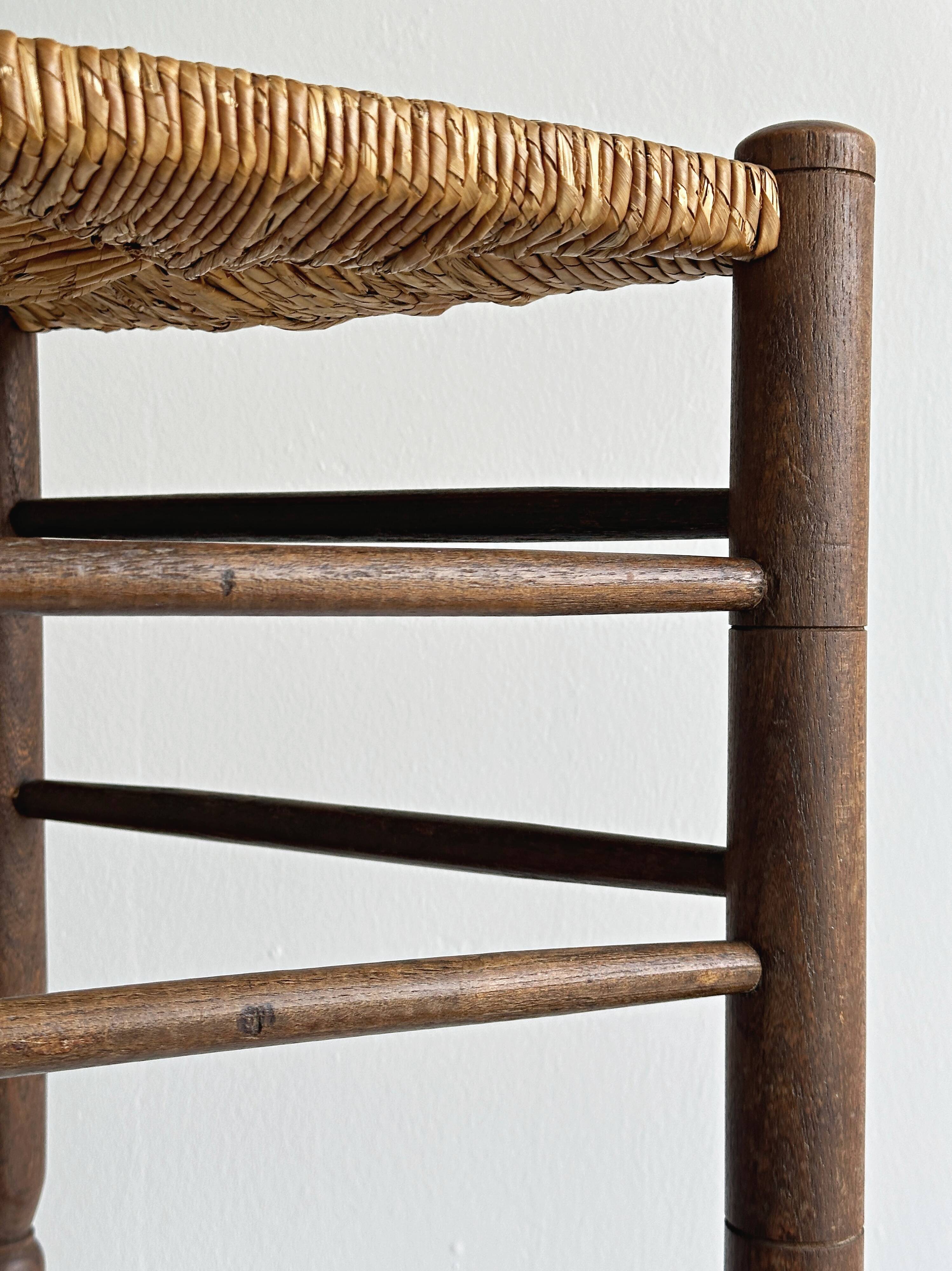 Triangular turned wooden stool
