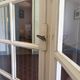 Triptych glass door with three panels featuring small panes. Vintage.