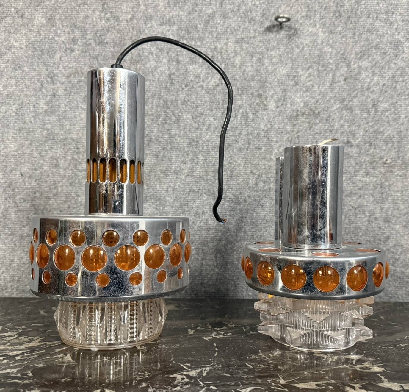 Two vintage space age pendant lamps by Raak, 1970