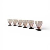 6 small Art Deco pink wine or water glasses with black stems.