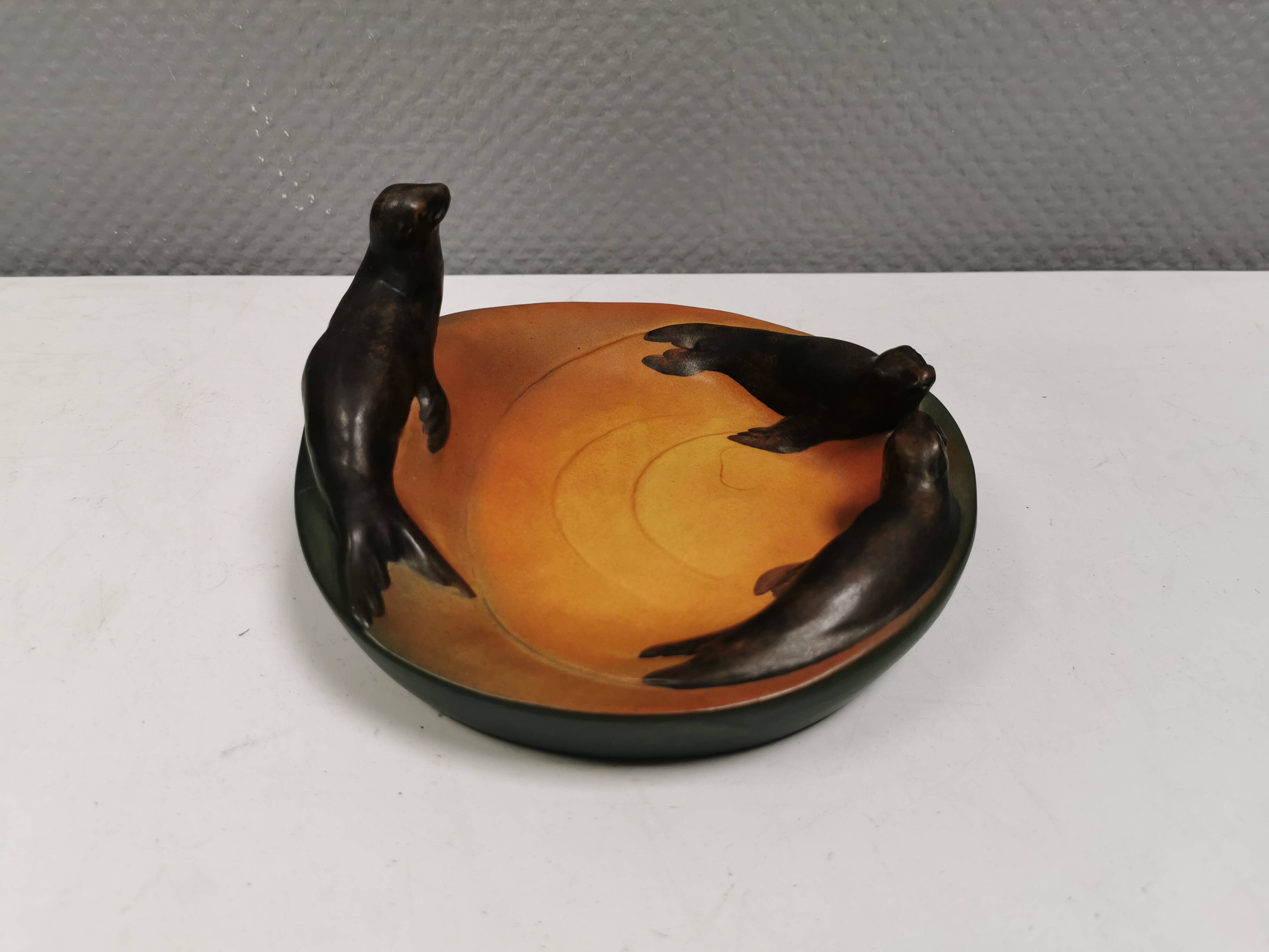Dish with sea lions hand painted by Ipsen's widow, Denmark 1930s.