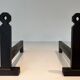 Pair of Minimalist Modernist Wrought Iron Chenets with Torch Holders in Nut Design