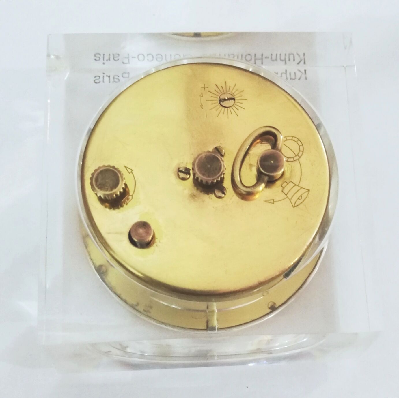Alarm clock with exposed mechanism in plexiglass and brass
