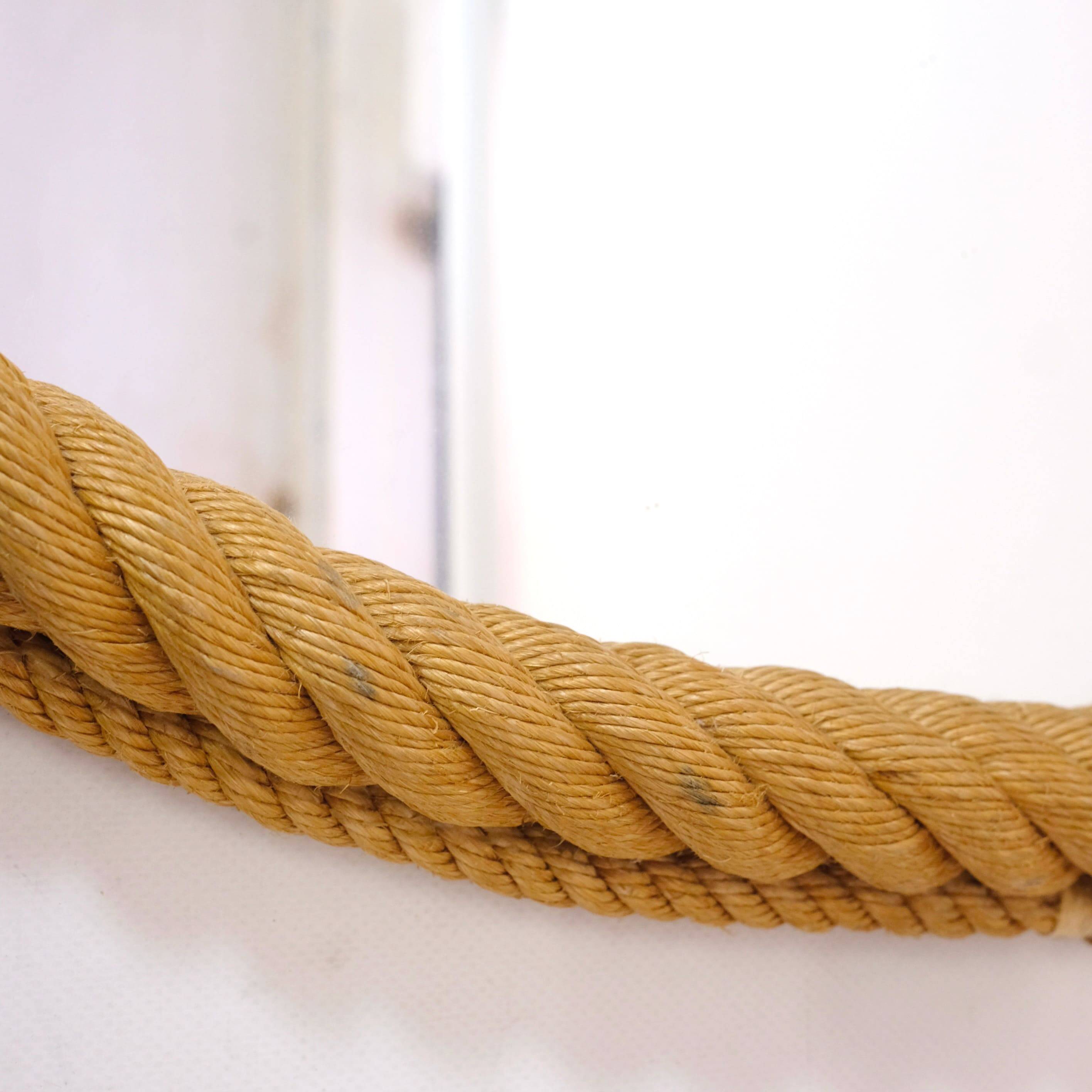 Large oval mirror in rope with pediment, 64cm x 56.5cm.