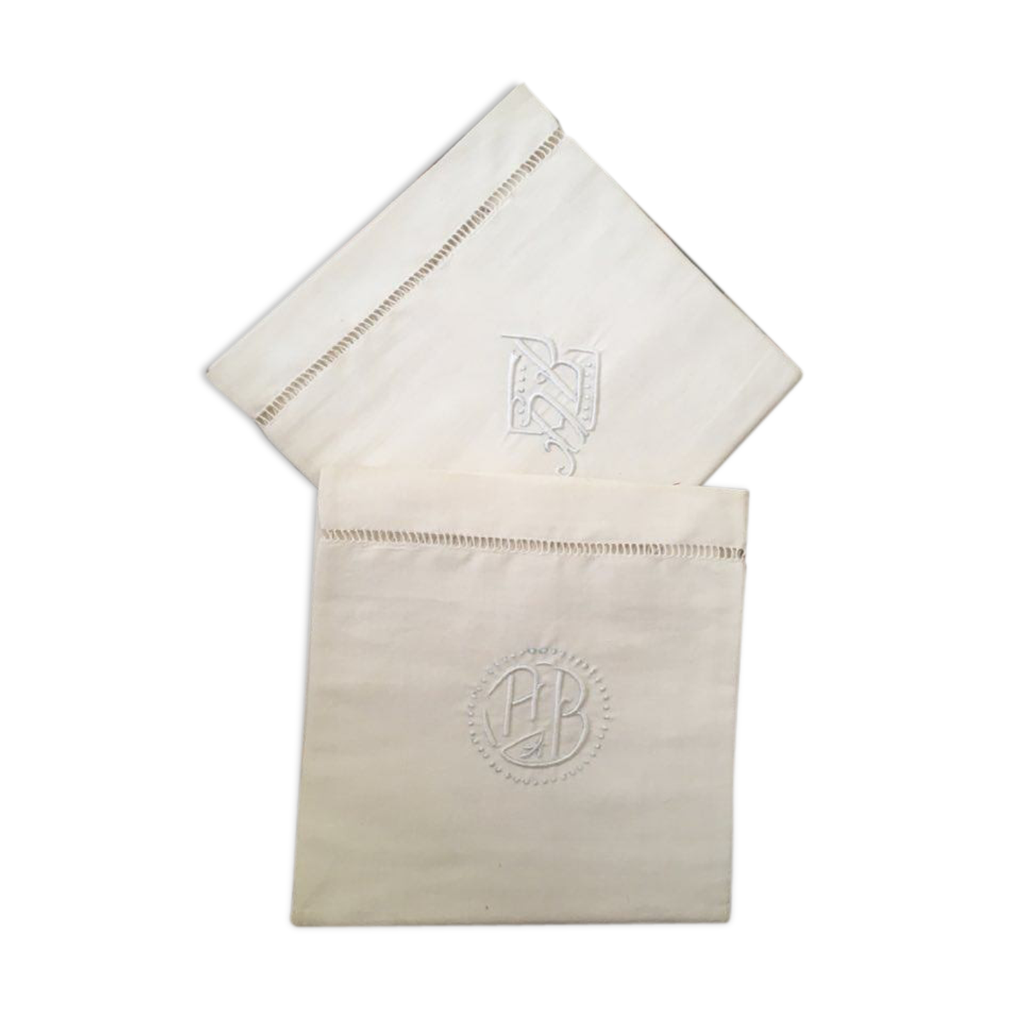 Two matching mixed pillowcases embroidered A B