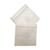 Two matching mixed pillowcases embroidered A B