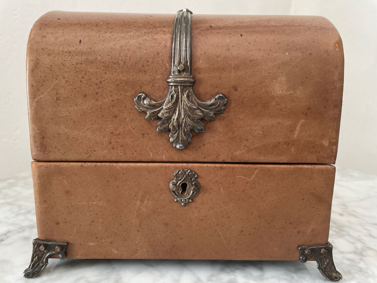 Vintage leather and silver metal jewelry box.