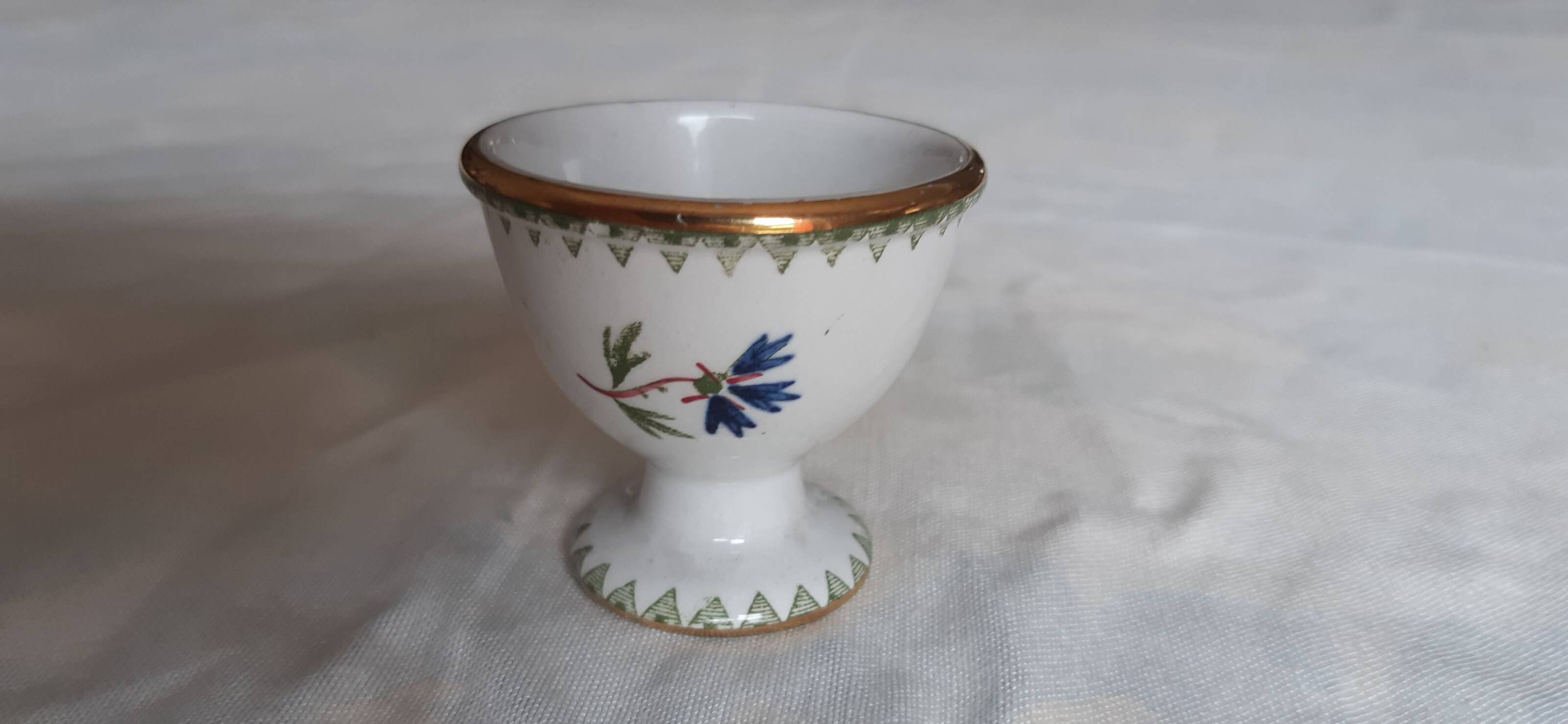 Set of three egg cups, barbel pattern decorations