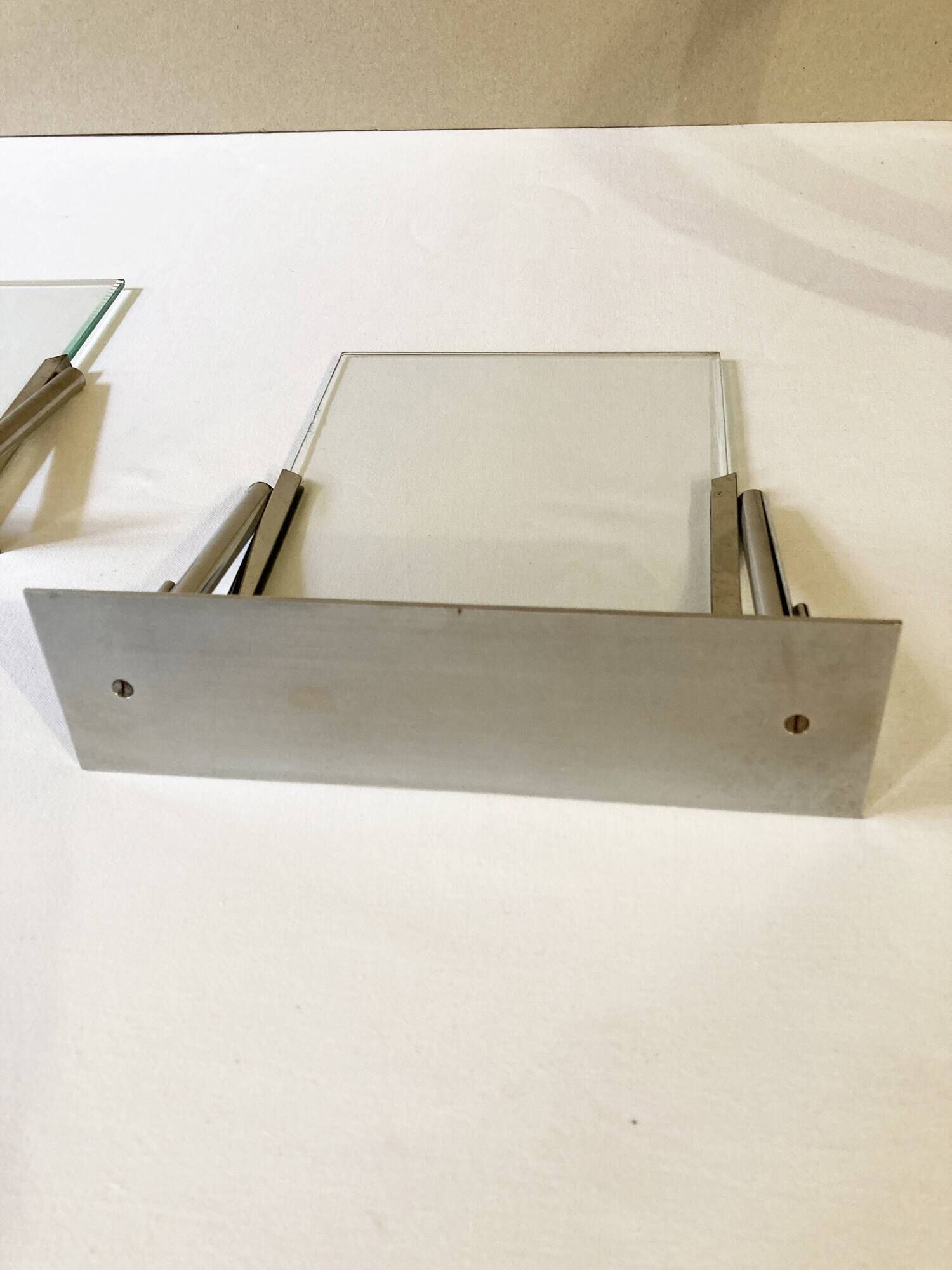 Duo of Art Deco photo frames in silver metal with beveled glass
