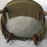 Olive green toad armchair with smooth velvet fringes.