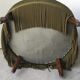 Olive green toad armchair with smooth velvet fringes.