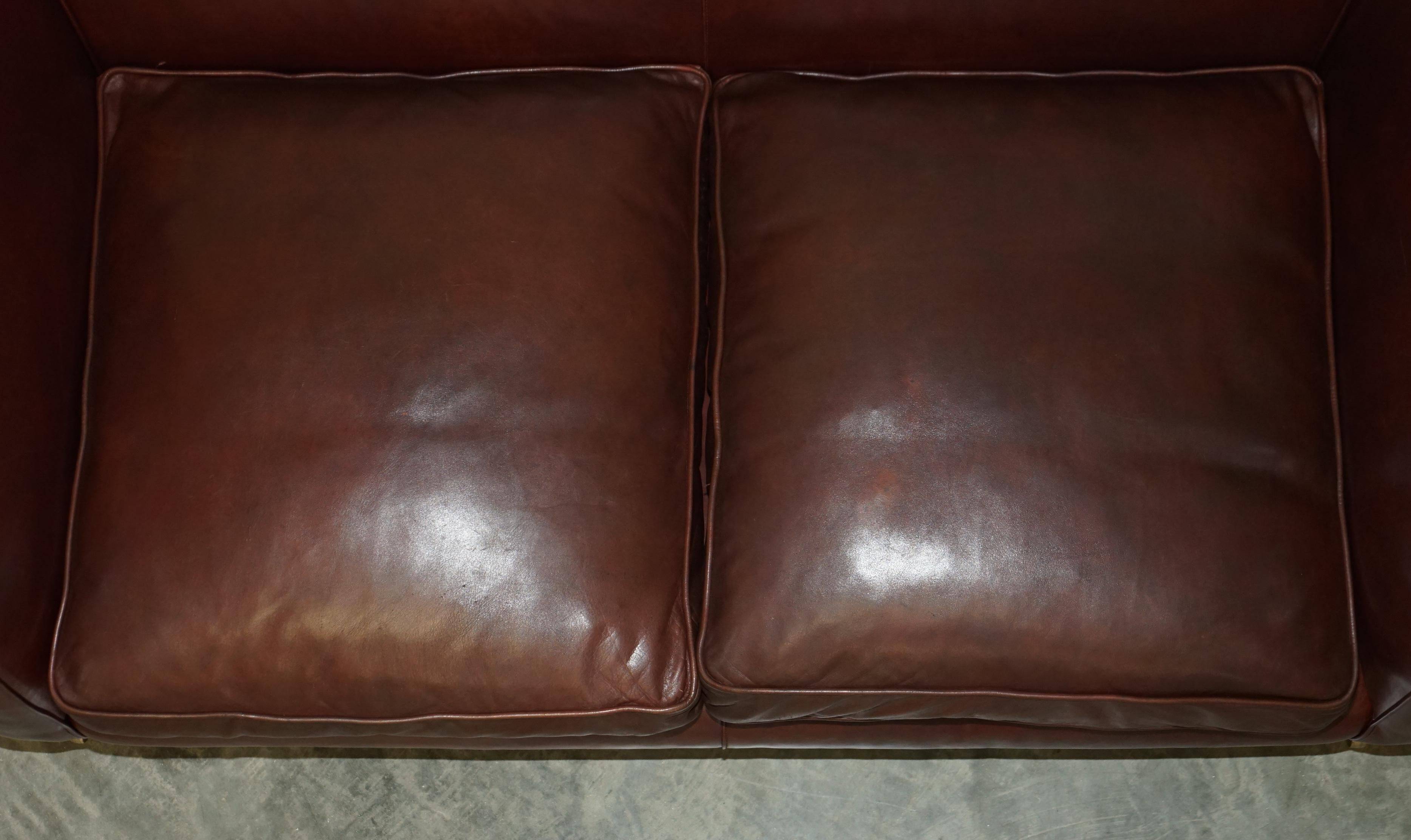 Vintage Art Deco leather sofa, three-seater, feather cushions.