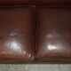 Vintage Art Deco leather sofa, three-seater, feather cushions.