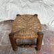 Rustic footrest made of wood and straw