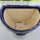 Wall pot in glazed blue terracotta with a grape motif, 1970s.