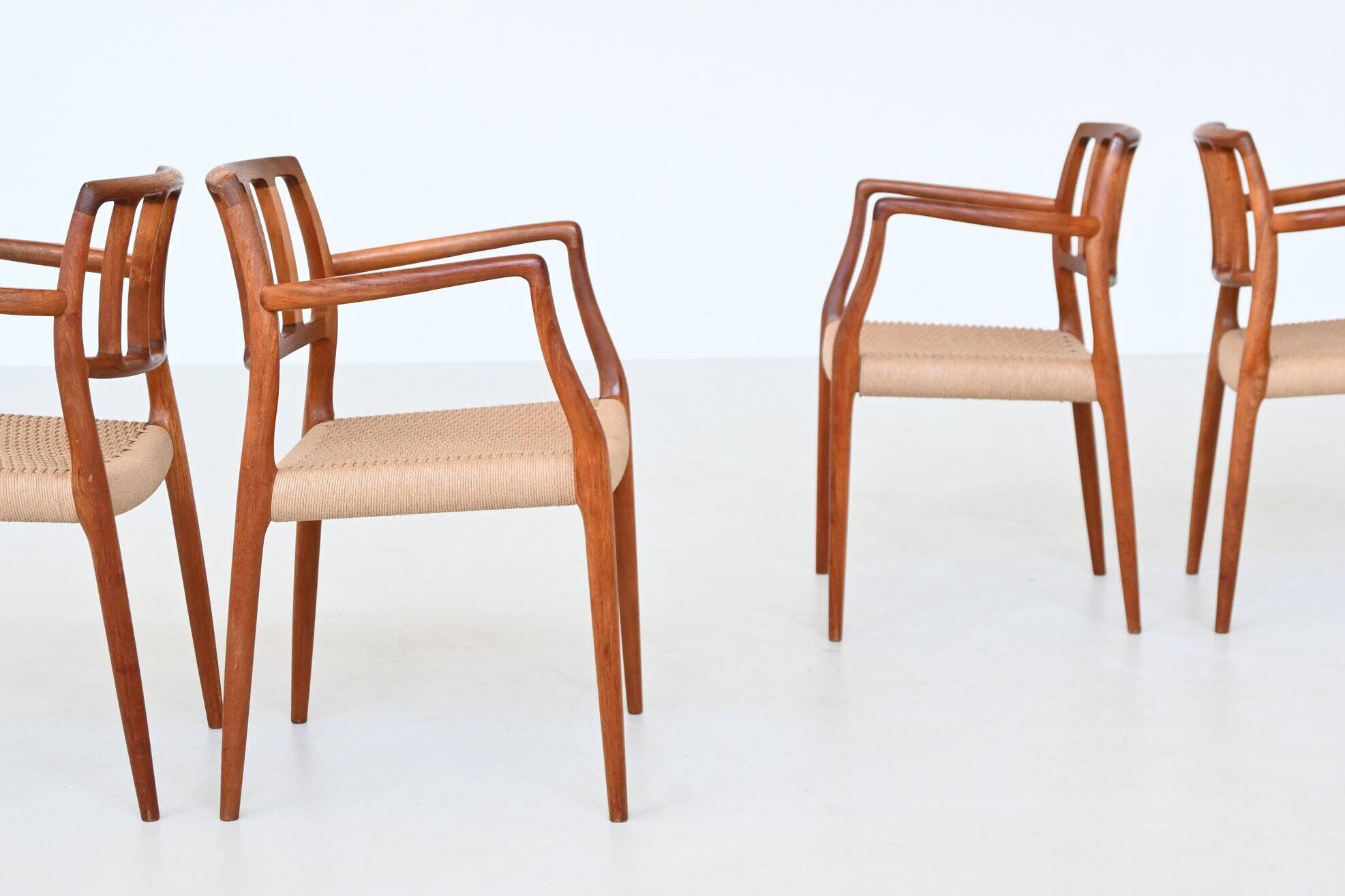 Niels Otto Moller model 66 armchairs teak and paper cord Denmark 1974