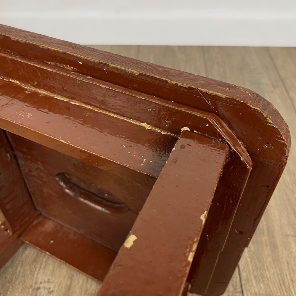 Old solid chocolate wooden stool
