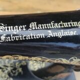 Old Singer sewing machine on pedestal