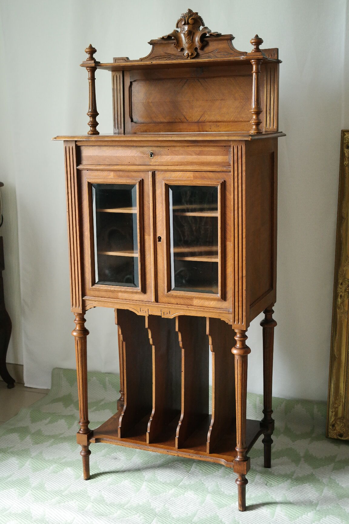 Louis XVI style music cabinet in walnut, 20th century.