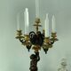 Candelabra with cherub in patinated bronze