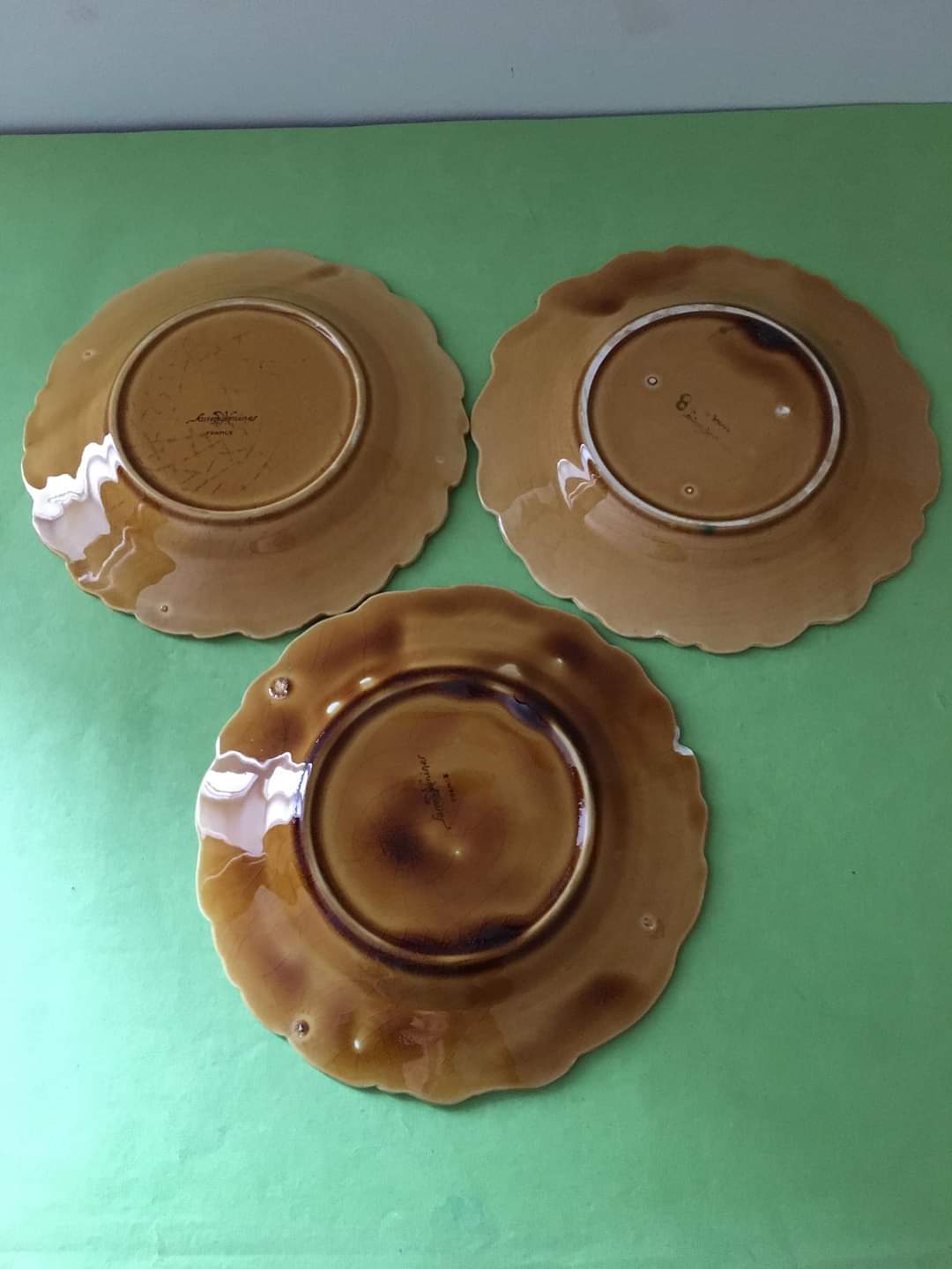 3 slip dessert plates stamped Sarreguemines. Fruit decor.