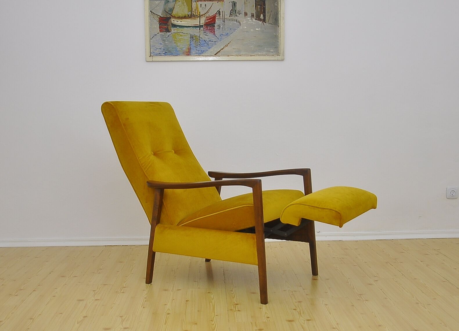 Mid-century armchair with folding footrest, 1960s