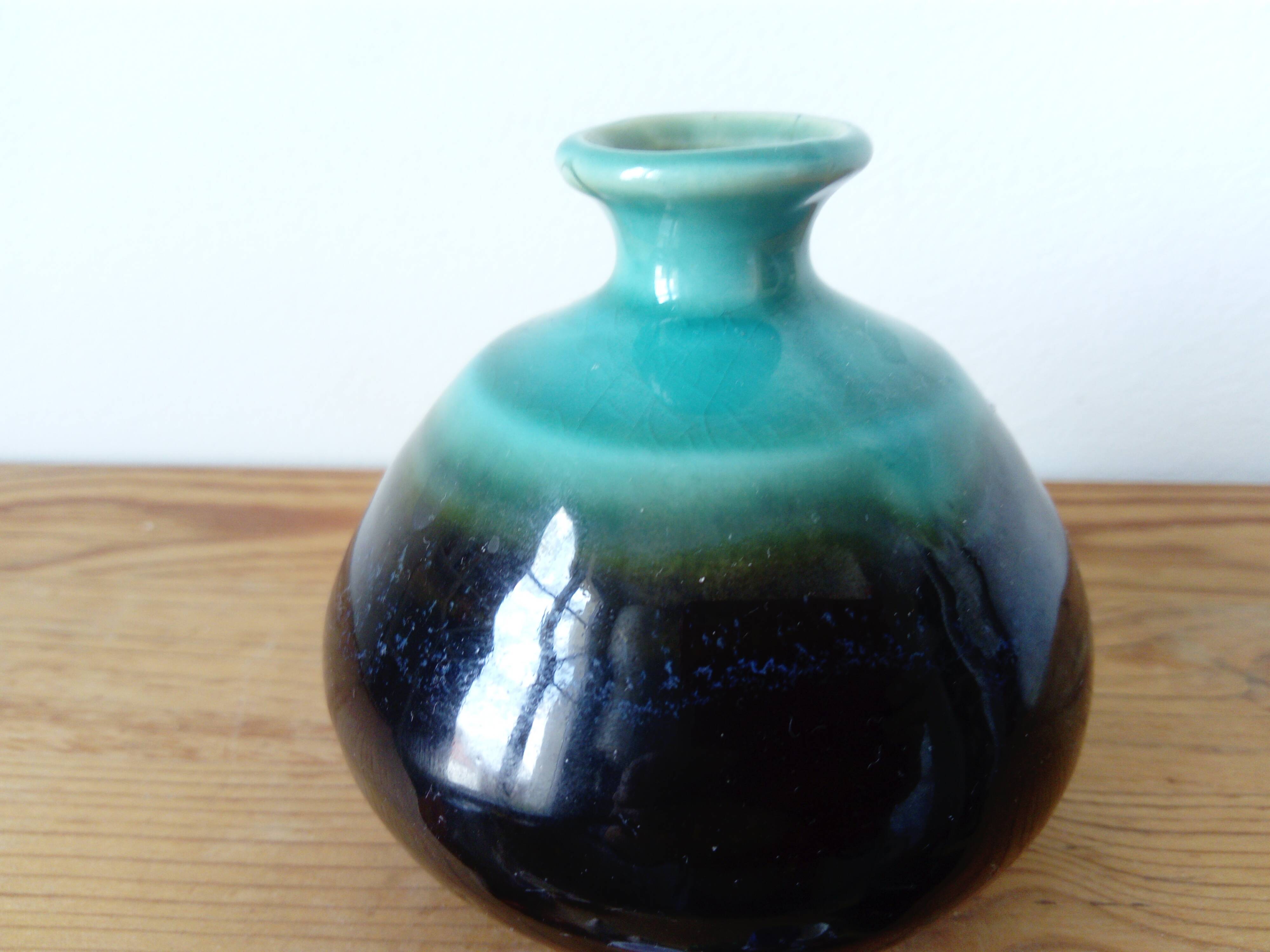 Small brown and turquoise ceramic vase