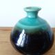 Small brown and turquoise ceramic vase